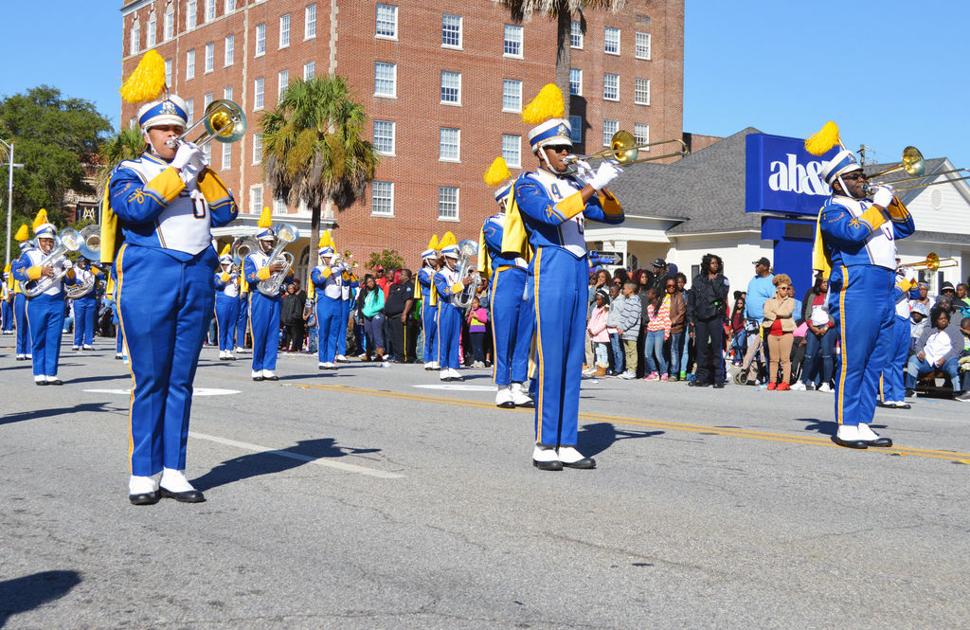 The Girls Inc. float makes it way through Pine Avenue in the Albany State University homecoming parade. (Staff Photo ... - The Albany Herald