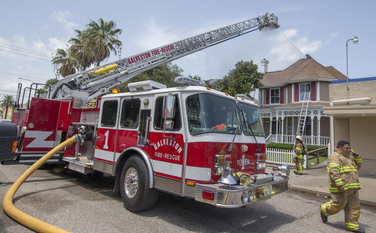 Galveston firefighters work at the scene of a fire in a dental office Galveston firefighters work at the scene of a fire in a dental office