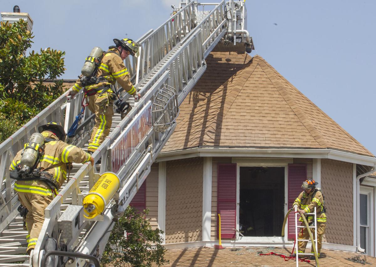 Galveston firefighters work at the scene of a fire in a dental office Galveston firefighters work at the scene of a fire in a dental office