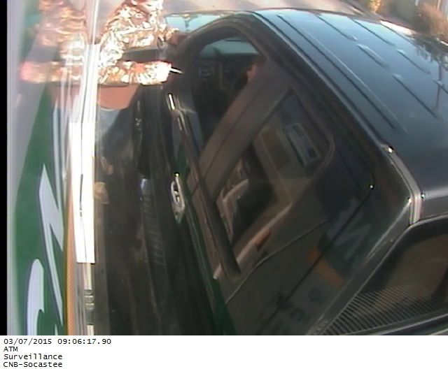 Man tries to rob woman at ATM