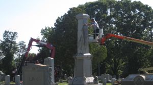 Confederate monument being assembled in cemetery