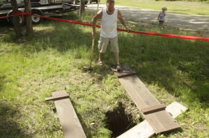 Deep sinkhole appears in man's yard
