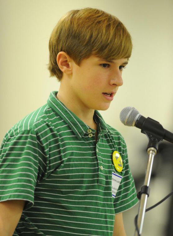 Opelika Middle School student Kevin Lazenby spells a word at the Lee County Spelling Bee hosted by Opelika City Schools Wednesday in Opelika. - 50f976b43c3c4.image