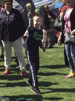 Adal Torres prepares to throw a softball