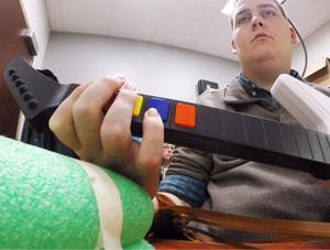 Brain implant lets paralyzed man regain use of hand