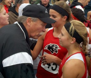 Fischer, Herky chase down defending cross country champs