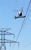 Workers use Helicopter to install 