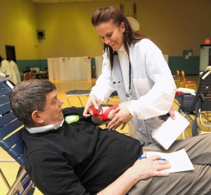 Hour Story Jim Merkel donates blood at the Knights of Columbus Hall in Granite City (01-24-12)