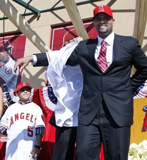 New Angels first baseman Albert Pujols puts on new jersey
