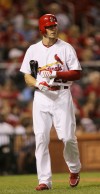 Colby Rasmus takes off his batting gloves after striking out