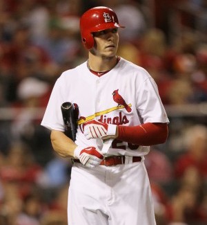 Colby Rasmus takes off his batting gloves after striking out