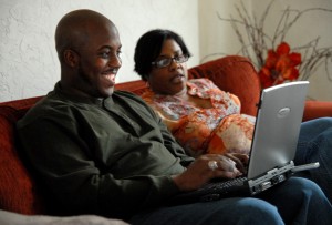 Couple watching TV on laptop computer