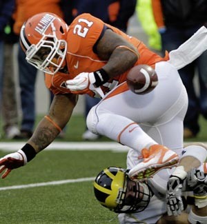 Illinois' Jason Ford fumbles against Michigan