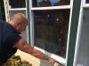Don Leeser points out BB holes in the front window of his St. Charles County home