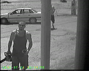 Surveillance image of gun theft suspect