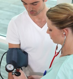 Nurse takes blood pressure