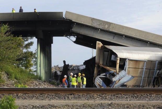 Seven hurt when trains collide, spurring collapse of southeast Missouri overpass