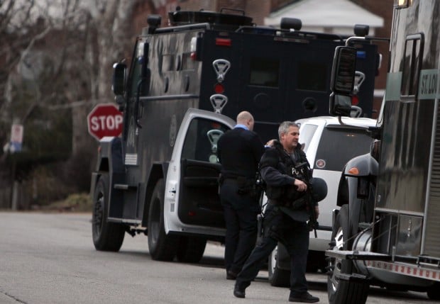 Shooting suspect's home searched