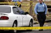 Police investigate the scene of a shooting in St. Louis