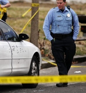 Police investigate the scene of a shooting in St. Louis