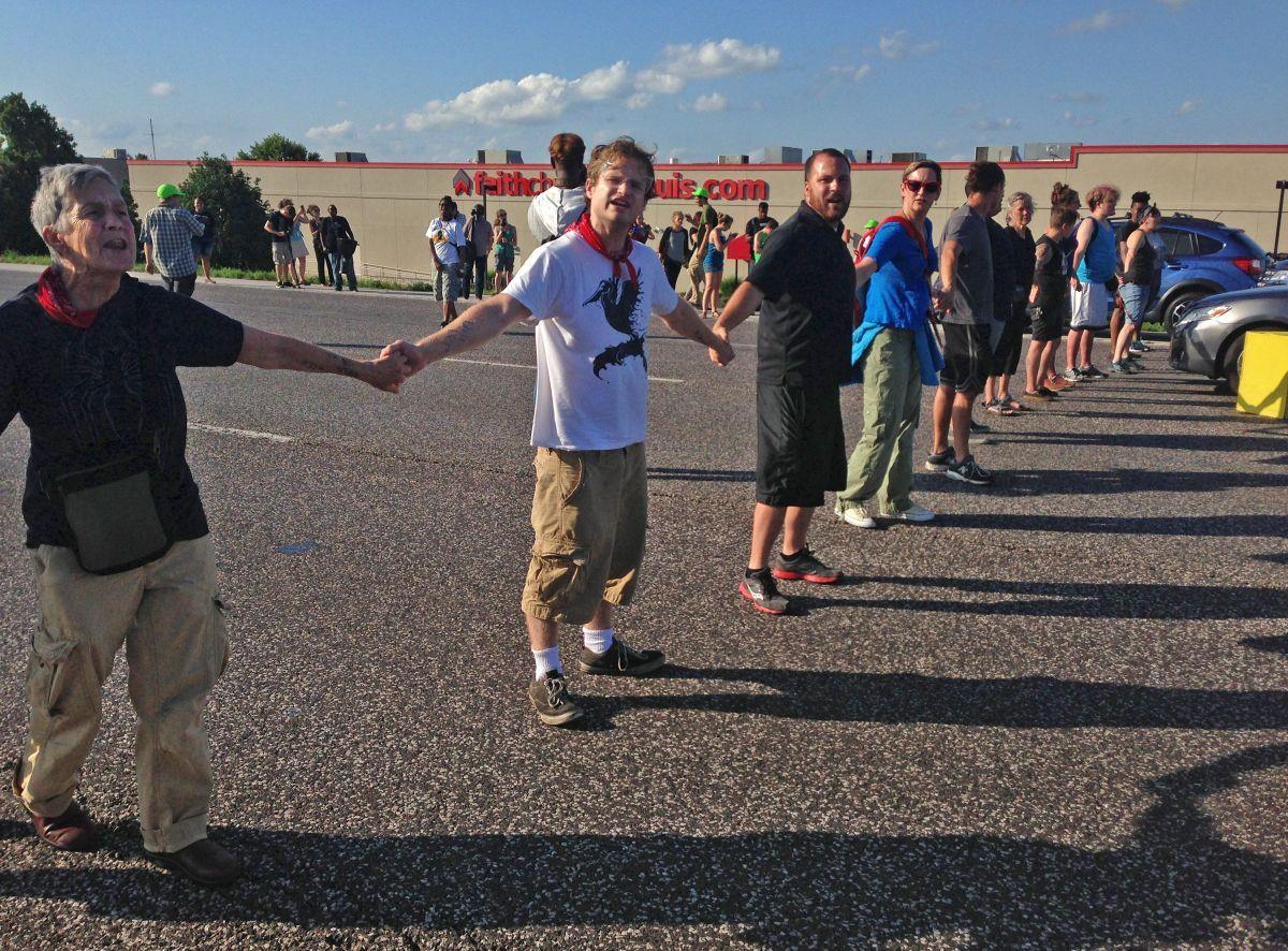 Ferguson protesters block rush-hour traffic on I-70 and get arrested