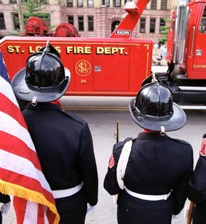 St. Louis Fire Department truck as firefighters look on