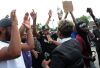 Scores protest police shooting of Michael Brown