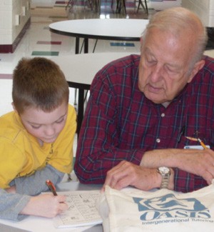 OASIS tutod Richard Schweiger reads with Jake in the Rockwood School District.