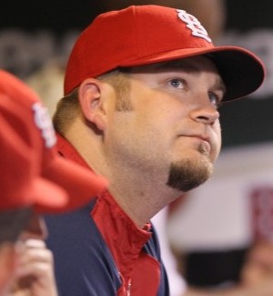 Penny watches from the dugout