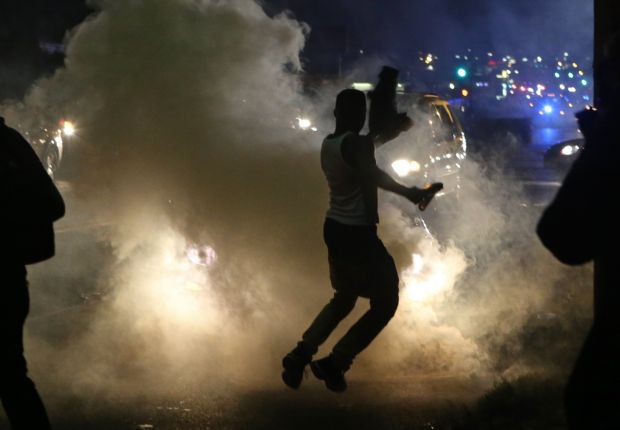 Police tear gas protesters again