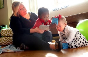 Adoptive mother takes on two same-age infants