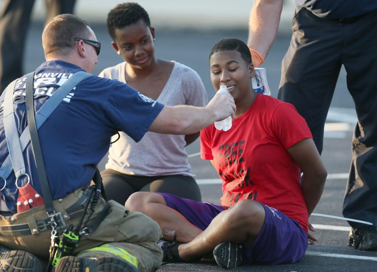Ferguson protesters block rush-hour traffic on I-70 and get arrested