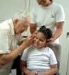 Bob Lammert checks a patient's ear