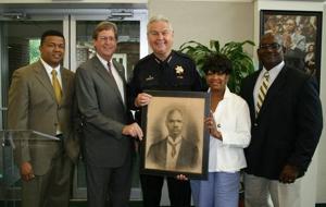 Police department presents photo of first African-American officer to Greenwood Cultural Center