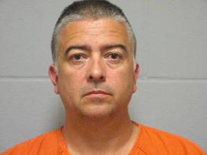 Former Perry officer arrested, accused of lewd acts with a minor
