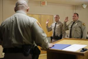 Two new deputies not deterred by scandal are first to be sworn in by Sheriff Vic Regalado