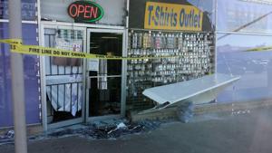 Retail owner locks in would-be shoplifter, cohorts free accomplice by ramming storefront with car