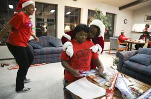 Volunteers assure kids in north Tulsa get visit from Santa and Mrs. Claus