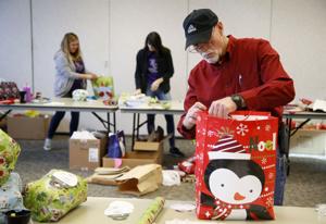 Volunteers gather to wrap hundreds of gifts donated to needy seniors