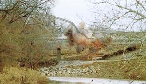WATCH: Portion of Bird Creek bridge on U.S. 169 removed with controlled explosives