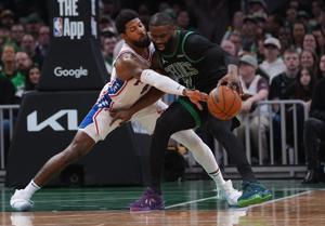 Apr 28, 2026; Boston, Massachusetts, USA; Philadelphia 76ers forward Paul George (8) defends against Boston Celtics guard Jaylen Brown (7) in the second quarter during game five of the first round of the 2026 NBA Playoffs at TD Garden. Mandatory Cred