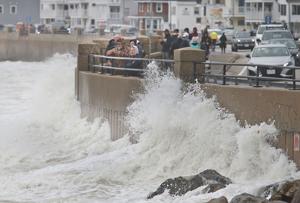 Braving the brine: Spectators watch nor’easter waves