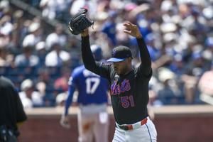 Jul 26, 2026; New York City, New York, USA; New York Mets pitcher Freddy Peralta (51) reacts while walking to the dugout after pitching the first inning against the Los Angeles Dodgers at Citi Field. Mandatory Credit: John Jones-Imagn Images