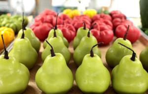LOS ANGELES, CA - June 18, 2026: A tray of pear and tomato candles are made at Happy Organics' studio in downtown Los Angeles on Thursday, June 18, 2026. (Christina House / Los Angeles Times)