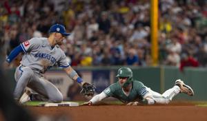 Royals make early lead hold, take series opener in Boston