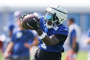 New York Giants wide receiver Malik Nabers (1) makes a catch during training camp at Quest Diagnostics Training Center.