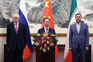 BEIJING, CHINA - MARCH 14: (L-R) Russian Deputy Foreign Minister Sergei Ryabkov, Chinese Vice Foreign Minister Ma Zhaoxu and Iranian Deputy Foreign Minister Kazem Gharibabadi meet with members of the media after their meeting at Diaoyutai State Guest