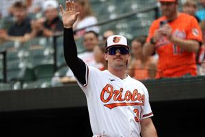 Former Orioles catcher Adley Rutschman waives to the fans before a game against the Kansas City Royals at Oriole Park at Camden Yards on July 12, 2026. Rutschman is reportedly being traded to the Boston Red Sox.