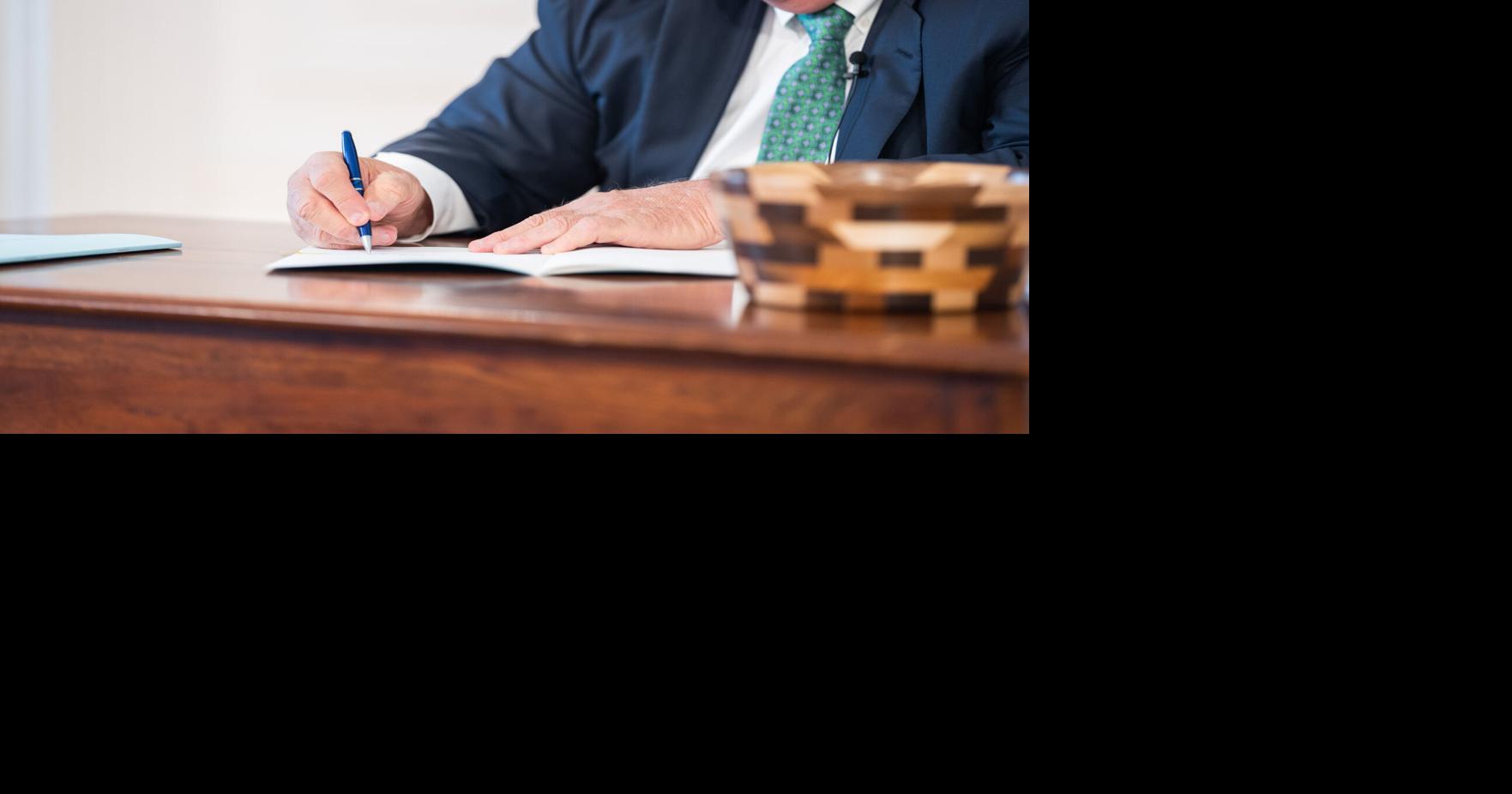 Justice signs budget bill, state employee pay increase, PEIA bill