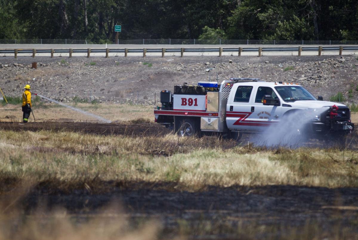 Yakima city worker treated for smoke inhalation after grass fire